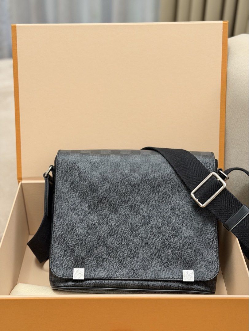 Authentic Louis Vuitton Graphite District Messenger Bag (Category: Sling Bags) located in Manila. Submitted by maria_2326 (Listing ID 1467009631, Image 2). Description: 💯% Authentic w/ box and dust bag No lowballing! Location: Manila/QC.