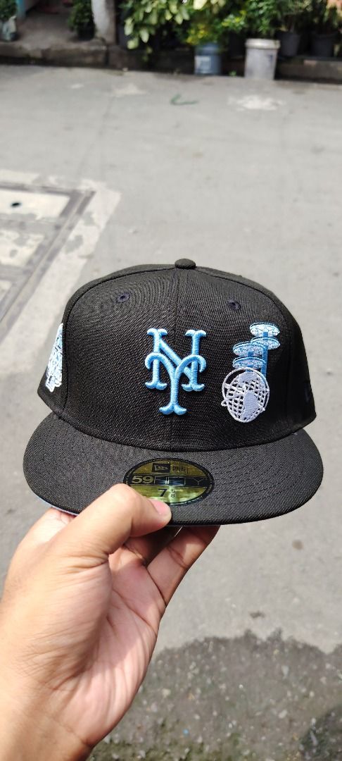Authentic New Era 59FIFTY New York Mets Fitted Hat (Category: Caps & Hats) located in Paranaque City. Submitted by easymommygo (Listing ID 1466978801, Image 1). Description: - Brand: New Era 59FIFTY - Team: New York Mets - Size: 7 5/8 - Colorway: Black with light blue under brim - Details: Custom side patch with front and back embroidery - Condition: Brand new, never worn outside - Extras: All original brim stickers intact, clean interior sweatba