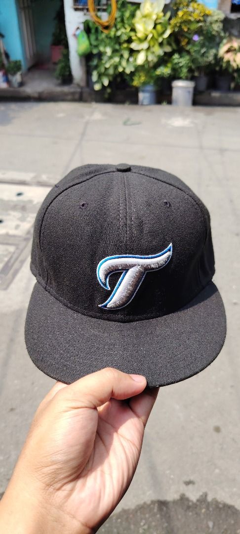 Authentic New Era 59FIFTY Toronto Blue Jays Cap (Category: Caps & Hats) located in Paranaque City. Submitted by easymommygo (Listing ID 1466978159, Image 2). Description: - Brand: New Era 59FIFTY Fitted Cap - Team: Toronto Blue Jays - Color: Classic Black - Size: 7 1/2 - 7 5/8 - Features: Structured panels, flat brim, and MLB Authentic tag - Condition: Clean interior sweatband, well-maintained.