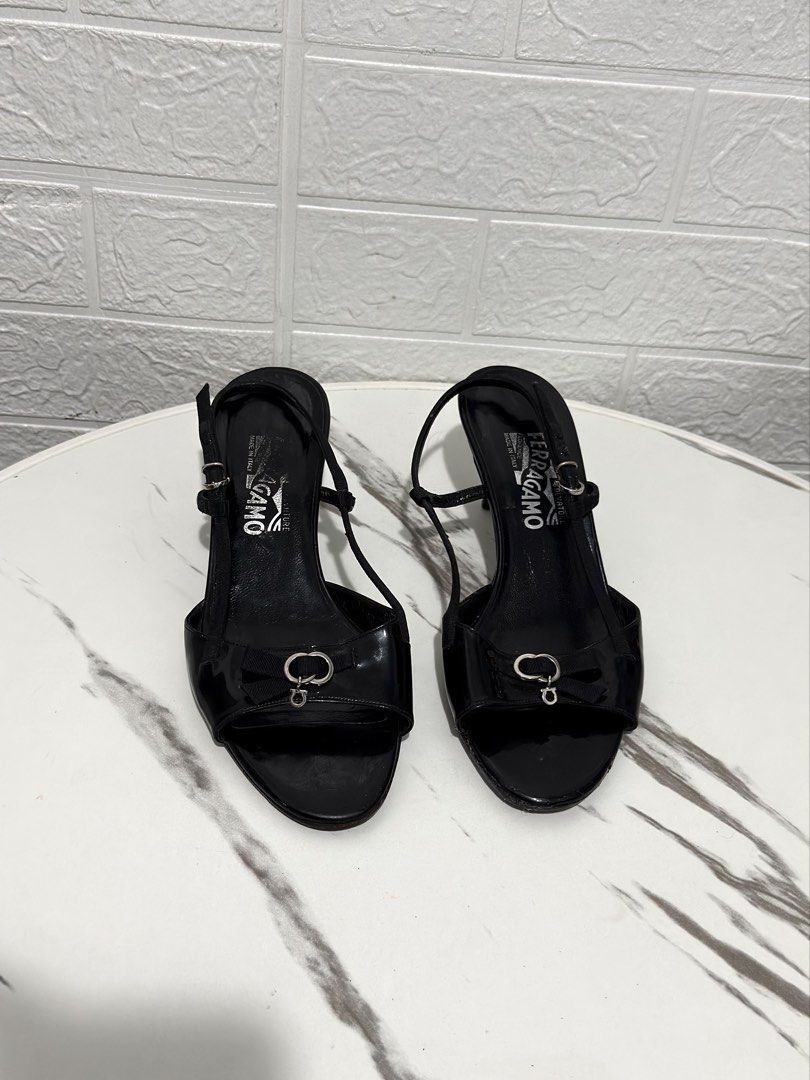 AUTHENTIC SALVATORE FERRAGAMO SLINGBACK HEELS (Category: Heels) located in Daraga. Submitted by jasmor (Listing ID 1467136924, Image 2). Description: 🎀personal; rarely used po, natambak lang 🎀black patent leather NO PEELING 🎀di pa gaano kapudpod, halata naman sa pic & sturdy pa; minimal signs of use sa heel pero di naman halata kasi black na black parin 📐23cm if wide; 23.5 cm if slim fit 📐2 inches heels; very comfy 🎀adjustable garterized st