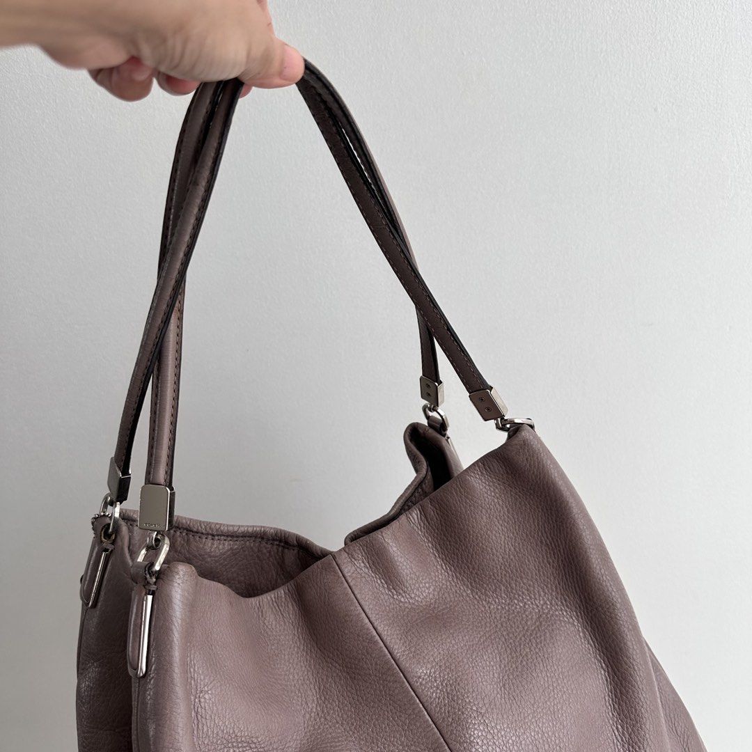Authentic Vintage Coach Leather Hobo Bag (Category: Luxury Bags & Wallets) located in Paranaque City. Submitted by closetmalou (Listing ID 1467116257, Image 2). Description: Authentic Vintage Coach Leather Hobo Bag Beautiful Coach shoulder bag in a unique taupe-mauve shade, featuring soft pebbled leather, silver-tone hardware, a spacious interior, and a zippered front pocket. A timeless everyday bag with a relaxed, slouchy silhouette. Size: * Bot
