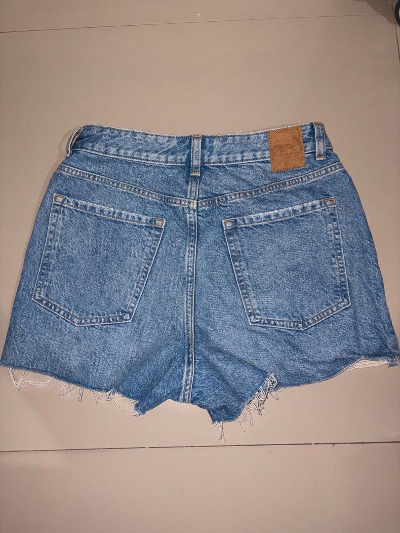 72. Authentic Zara High-Rise Denim Shorts with Button Fly (Category: Shorts) located in Manila. Submitted by athenabrave (Listing ID 1467029900, Image 2). Description: Selling these gorgeous Zara denim shorts in excellent, well-loved condition! Features a classic high-waisted fit, full copper button-down fly, and a beautifully frayed, distressed raw hem. Perfect for effortless casual, streetwear, or beach day outfits. • Brand: Zara (Inditex) • Si