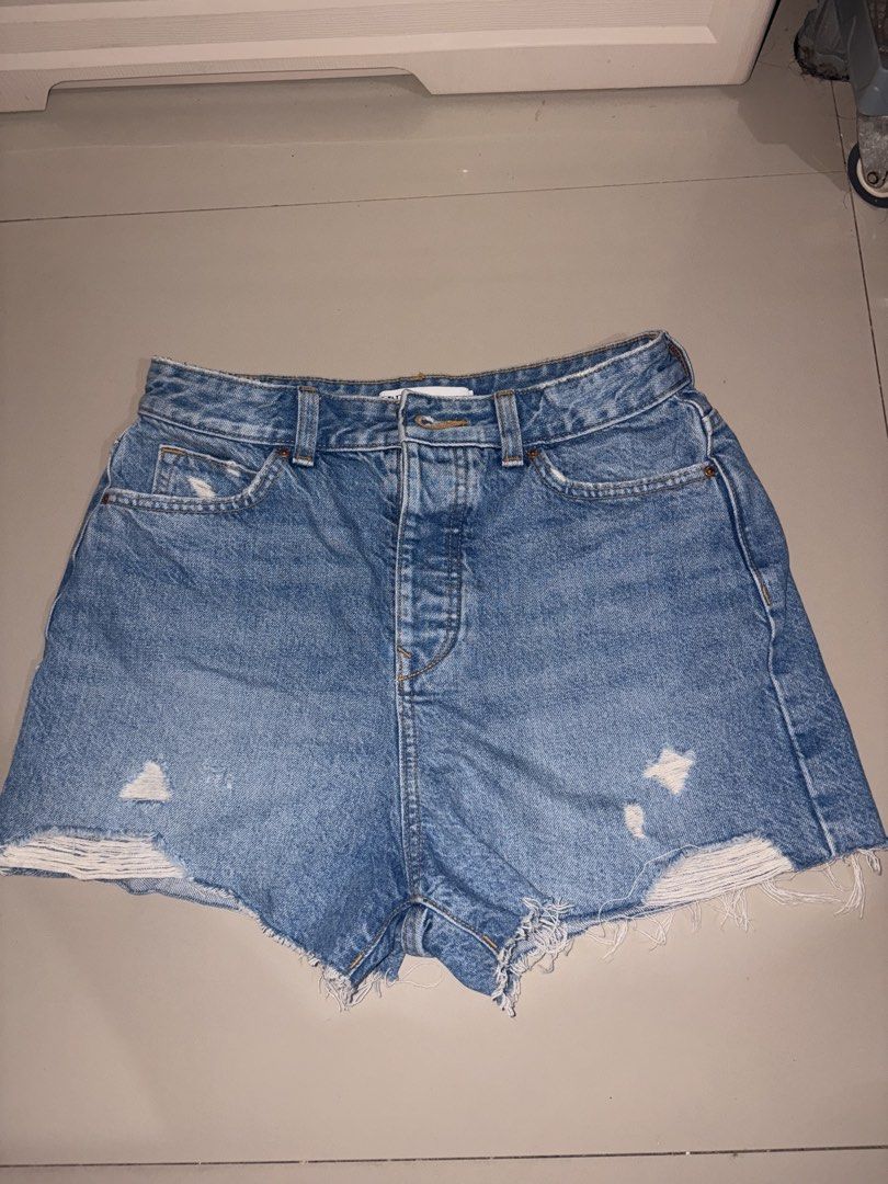 72. Authentic Zara High-Rise Denim Shorts with Button Fly (Category: Shorts) located in Manila. Submitted by athenabrave (Listing ID 1467029900, Image 1). Description: Selling these gorgeous Zara denim shorts in excellent, well-loved condition! Features a classic high-waisted fit, full copper button-down fly, and a beautifully frayed, distressed raw hem. Perfect for effortless casual, streetwear, or beach day outfits. • Brand: Zara (Inditex) • Si