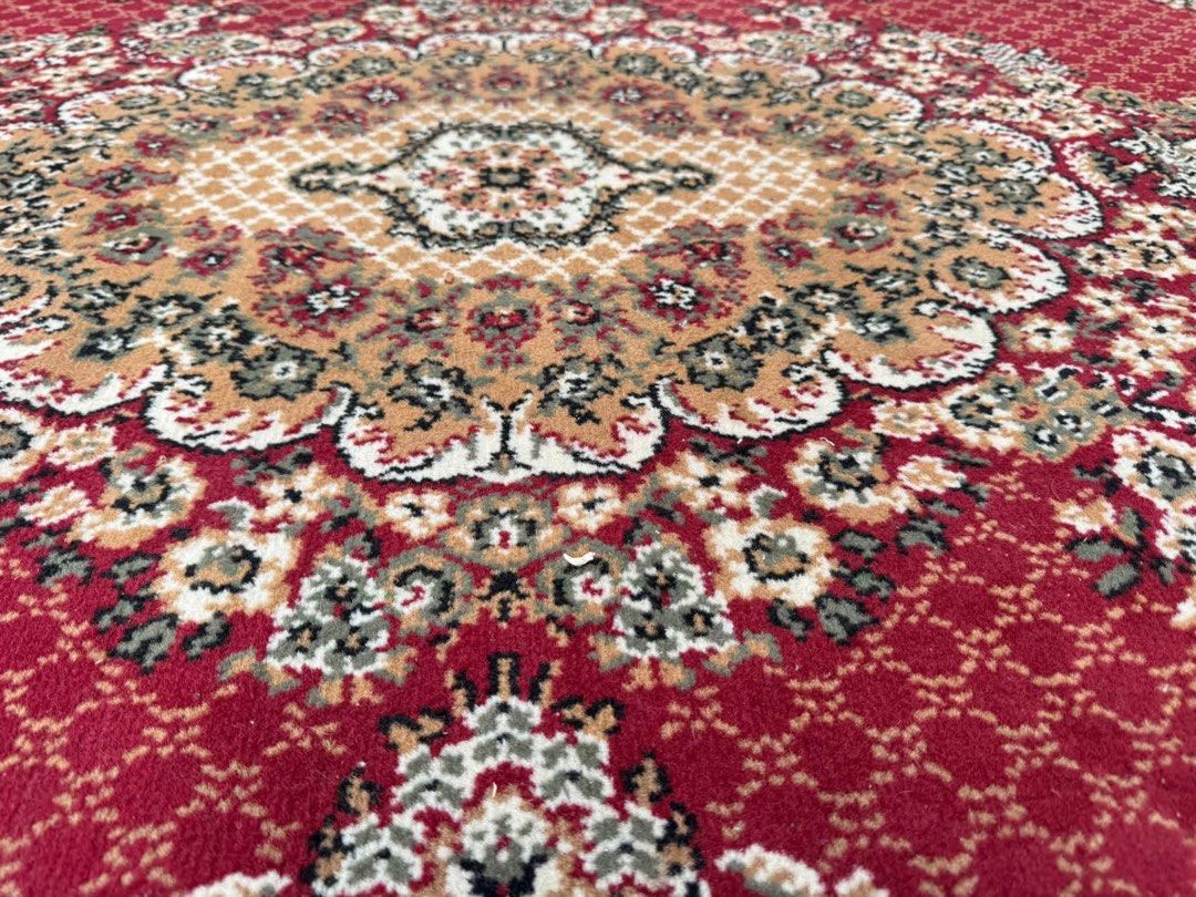 Available- Red Persian Style (Category: Carpets, Mats & Flooring) located in Manila. Submitted by swiftearth-726f (Listing ID 1467062033, Image 3). Description: - Design: Traditional Persian-inspired pattern with intricate floral details - Color Palette: Deep red background with beige, black, and green accents - Features: Beautiful decorative fringe along both ends - Texture: Thick pile, very soft and comfortable underfoot - Condition: Clean over