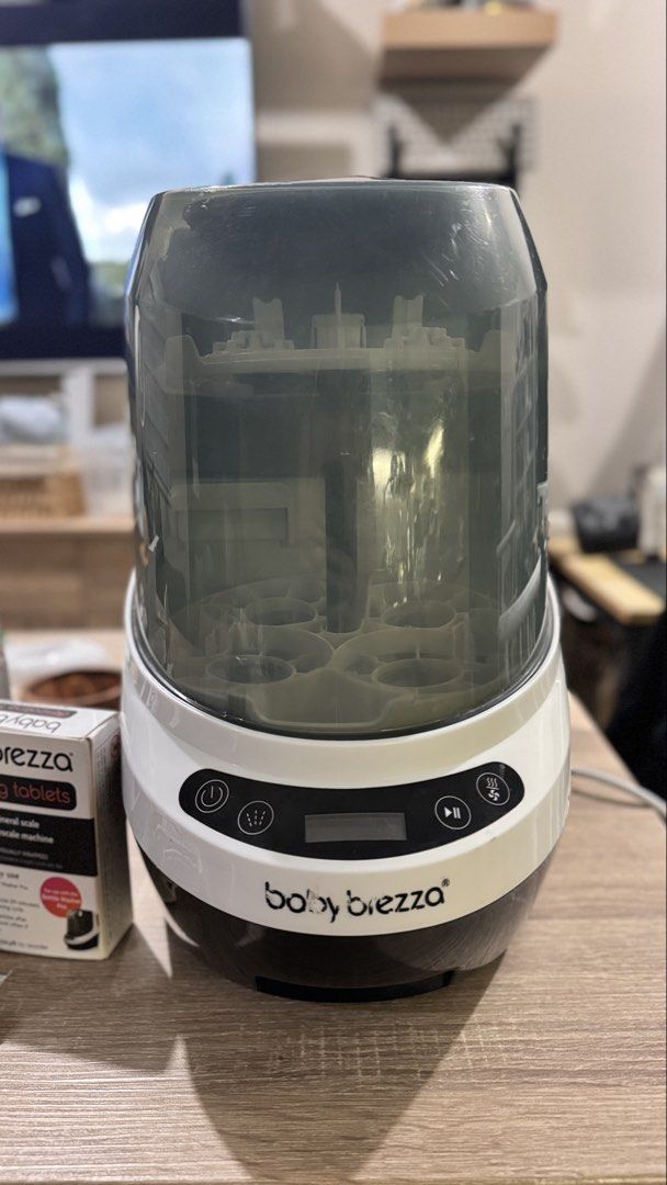 Baby Brezza Bottle Washer Pro (Category: Breastfeeding & Bottle Feeding) located in Pasay City. Submitted by calmcloud.5b2569 (Listing ID 1467098709, Image 2). Description: - Authentic Baby Brezza automatic bottle washer, sterilizer, and dryer - Sleek white and grey exterior with a user-friendly digital touch control panel - Multi-tier internal rack securely holds multiple bottles and breast pump parts - Easy-fill water tank at the back with clea