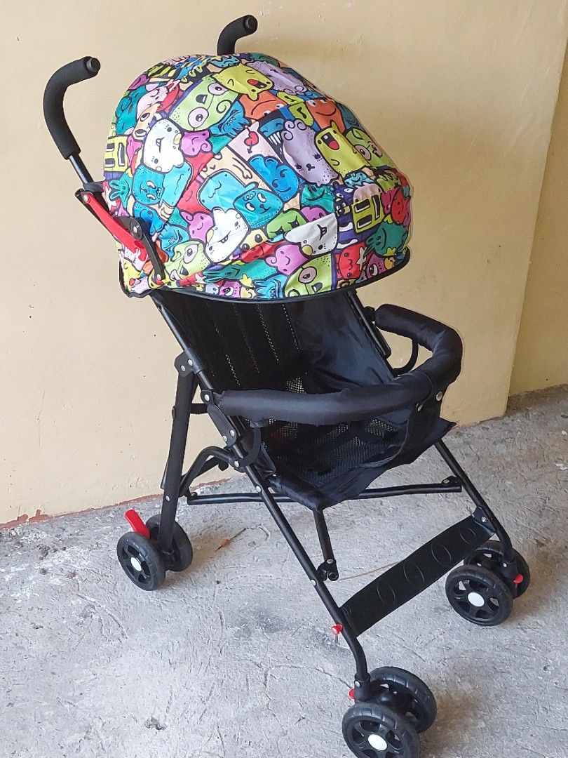 Baby Lightweight Stroller - Colorful Print / Foldable (Category: Strollers) located in Bulacan. Submitted by darkfit (Listing ID 1467083840, Image 2). Description: Baby Stroller for Sale 👶 ₱1,200 ONLY - Lightweight & foldable - With canopy & front bar - Good working condition 📍 sjdm bulacan | Can ship agad DM to mine!.