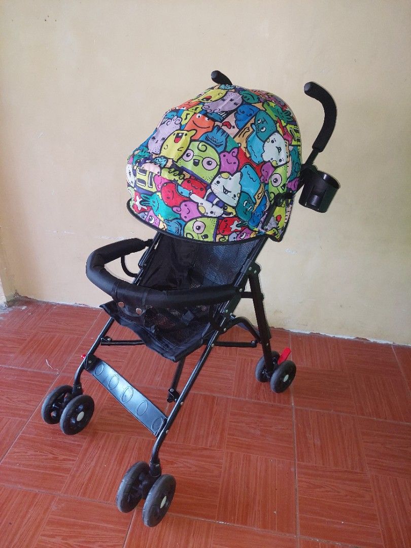 Baby Lightweight Stroller - Colorful Print / Foldable (Category: Strollers) located in Bulacan. Submitted by darkfit (Listing ID 1467083840, Image 3). Description: Baby Stroller for Sale 👶 ₱1,200 ONLY - Lightweight & foldable - With canopy & front bar - Good working condition 📍 sjdm bulacan | Can ship agad DM to mine!.