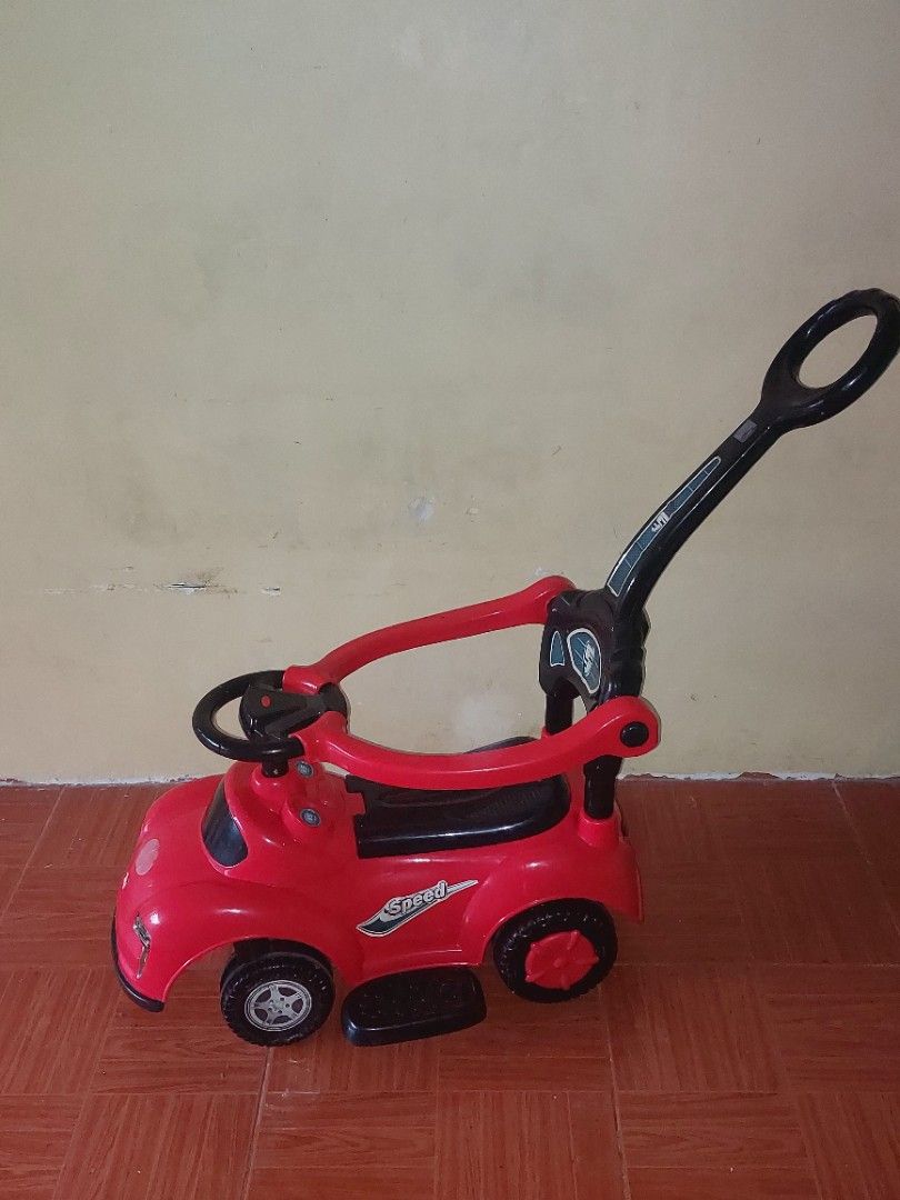 Baby Ride-On Push Car with parent handle (Category: Other Kids Furniture) located in Bulacan. Submitted by darkfit (Listing ID 1467082953, Image 1). Description: Good condition, still sturdy. Perfect for 1-3 years old. With parent push handle at the back, steering wheel, and storage under the seat. Color red, plastic material, easy to clean. RFS: Hindi na ginagamit ni baby, need na ng space. Location: sjdm bulacan - for pickup / lalamove. PM lang