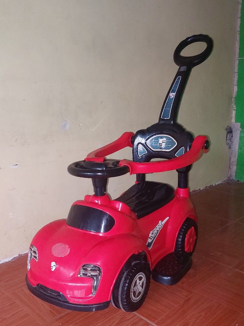 Baby Ride-On Push Car with parent handle (Category: Other Kids Furniture) located in Bulacan. Submitted by darkfit (Listing ID 1467082953, Image 2). Description: Good condition, still sturdy. Perfect for 1-3 years old. With parent push handle at the back, steering wheel, and storage under the seat. Color red, plastic material, easy to clean. RFS: Hindi na ginagamit ni baby, need na ng space. Location: sjdm bulacan - for pickup / lalamove. PM lang