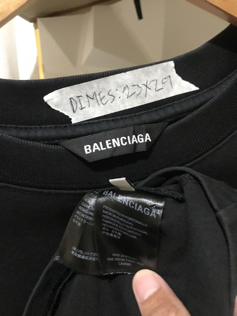 Balenciaga Grogu Star Wars Graphic Tee Black (Category: Luxury Apparel) located in Rizal. Submitted by drthriftone (Listing ID 1466973253, Image 3). Description: - Brand: Balenciaga - Design: Grogu graphic with white logo lettering on front - Fit: Relaxed fit with classic crew neckline - Color: Black - Origin: Made in Portugal - Measurements: As shown on tag taped to collar - Condition: 100% authentic, well-maintained.