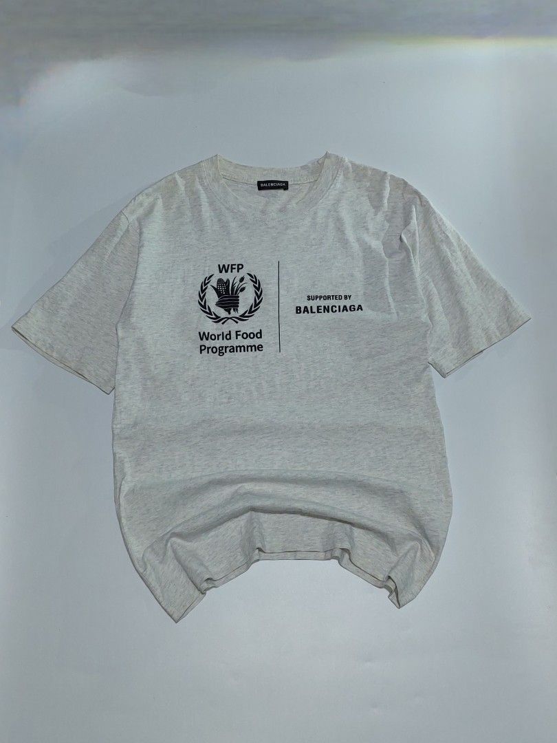 Balenciaga world food program tee (Category: Tshirts & Polo Shirts ) located in Tuguegarao City. Submitted by underground_hustl3 (Listing ID 1467096848, Image 1). Description: LENGTH -28 WIDTH -19 XS-ON TAG 𝗔𝗨𝗧𝗛𝗘𝗡𝗧𝗜𝗖𝗜𝗧𝗬 𝗚𝗨𝗔𝗥𝗔𝗡𝗧𝗘𝗘𝗗💎 COLOR RATE 9.5/10✅️ EXCELLENT CONDITION💯 UNLI VOUCH/VC ISSUE: CHECK PIC DM TO CLAIM📥 📍TUGUEGARAO CITY LUZON.