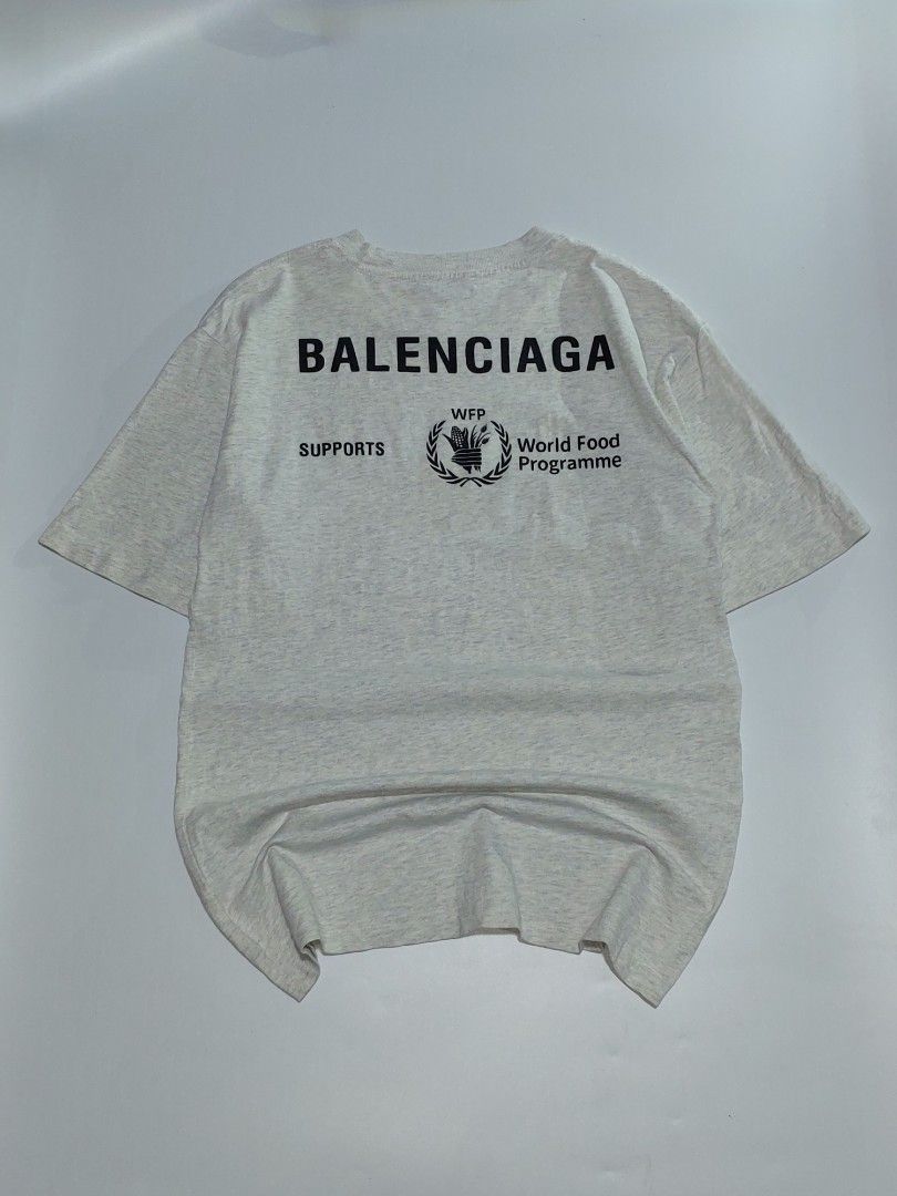 Balenciaga world food program tee (Category: Tshirts & Polo Shirts ) located in Tuguegarao City. Submitted by underground_hustl3 (Listing ID 1467096848, Image 2). Description: LENGTH -28 WIDTH -19 XS-ON TAG 𝗔𝗨𝗧𝗛𝗘𝗡𝗧𝗜𝗖𝗜𝗧𝗬 𝗚𝗨𝗔𝗥𝗔𝗡𝗧𝗘𝗘𝗗💎 COLOR RATE 9.5/10✅️ EXCELLENT CONDITION💯 UNLI VOUCH/VC ISSUE: CHECK PIC DM TO CLAIM📥 📍TUGUEGARAO CITY LUZON.