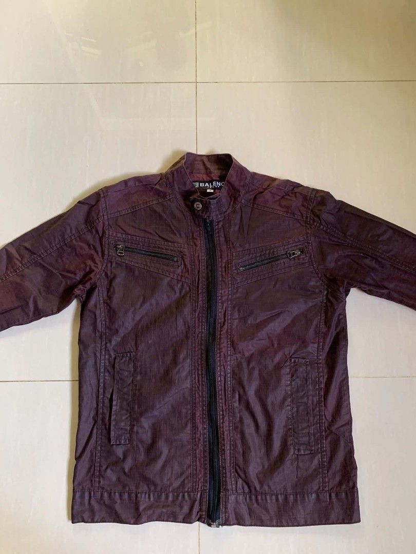Baleno Maroon Zipper Casual Jacket (Category: Coats, Jackets and Outerwear) located in Tiaong. Submitted by cdoswan (Listing ID 1467132797, Image 1). Description: - Brand/Model: Baleno dark maroon jacket - Closure: Front zip with snap button collar - Pockets: 2 zippered chest pockets and 2 lower pockets - Design: Textured fabric with visible stitching details on front and sleeves - Condition: Clean overall, great casual outer layer for cooler wea