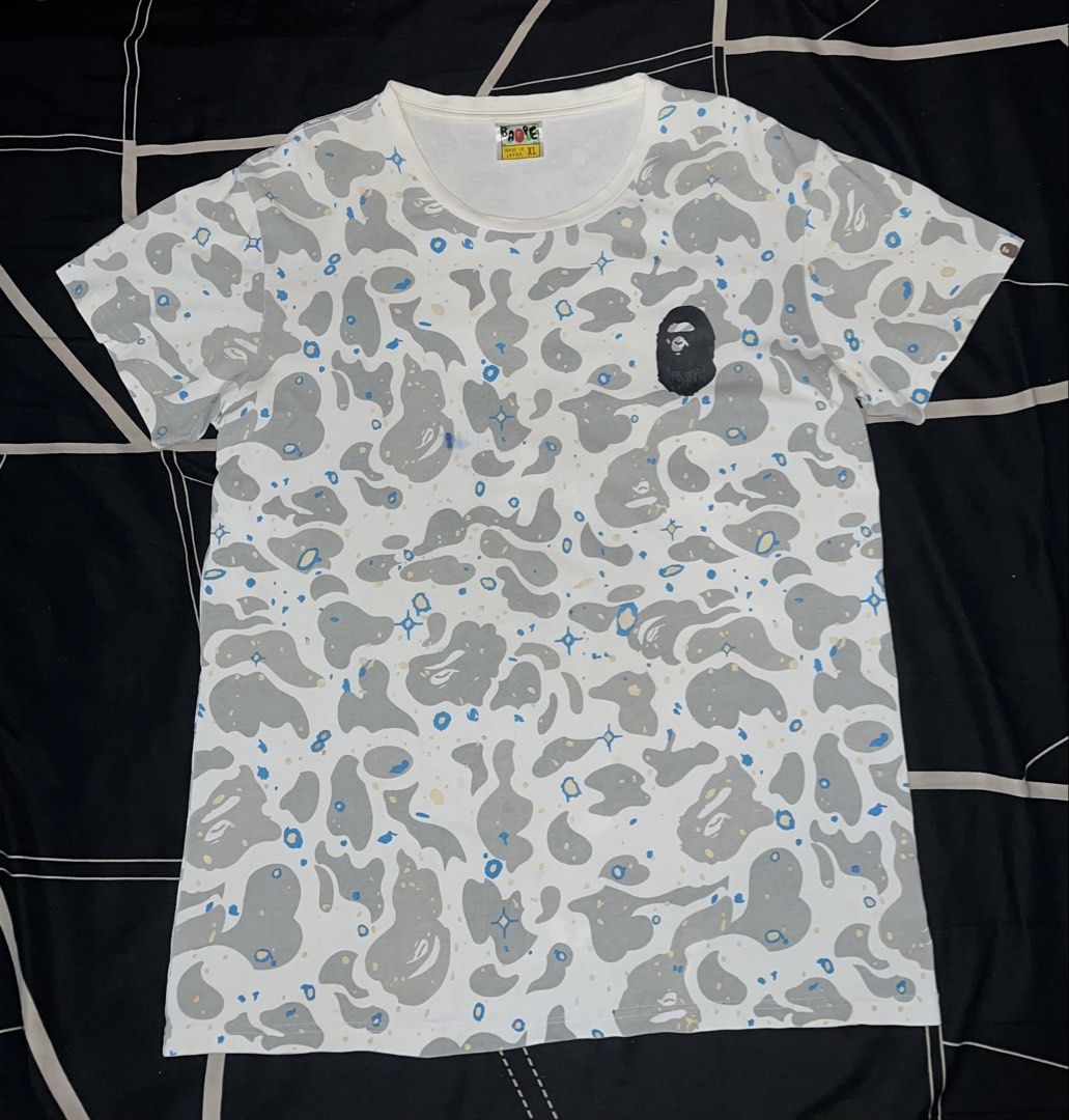 BAPE A Bathing Ape Space Camo Shirt (Category: Tshirts & Polo Shirts ) located in Cebu City. Submitted by jlturno1999 (Listing ID 1467127801, Image 1). Description: BAPE A Bathing Ape Space Camo Shirt Good for PSG 21x28 dimensions 9/10 color rate Issue hairline, blue and black stain, bacon neck Need wash.