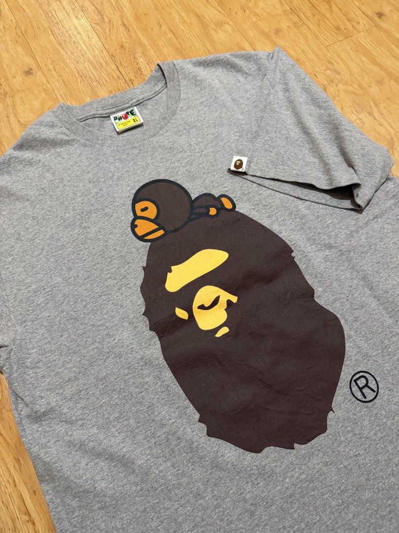 BAPE Milo on Big Head Tee (Category: Tshirts & Polo Shirts ) located in Danao, Cebu. Submitted by yunoball (Listing ID 1467080079, Image 2). Description: Size XL on tag 22x28 Condition: excellent Issues: none Guaranteed authentic.