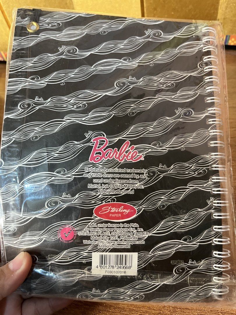 Barbie Slam Book Spiral Notebook (Category: Stationery & School Supplies) located in Gapan. Submitted by lunashop14 (Listing ID 1467094928, Image 2). Description: - Official Mattel Licensed Product by Sterling Paper - Brand new and still sealed in plastic packaging - Features a chic black and white wave pattern cover with a pink elastic closure strap - Spiral binding for easy writing - Includes fun inside questionnaires like Pop Ups, Innermost, L