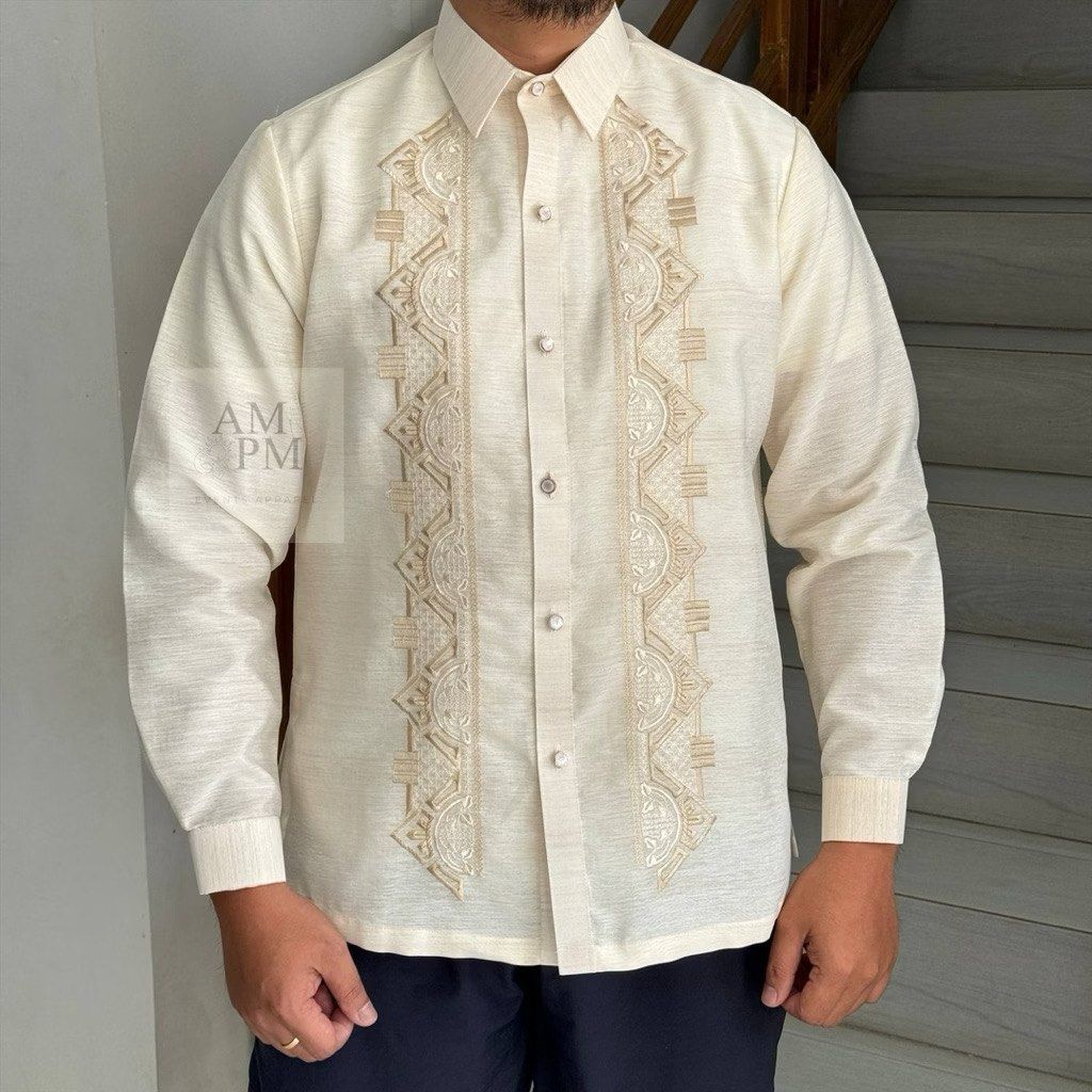 Barong Tagalog (XS) (Category: Formal Shirts) located in Manila. Submitted by double__j (Listing ID 1466982577, Image 1). Description: - Brand: Aga't Gabbi - Color: Ivory cream with intricate tan embroidery - Design: Long sleeves, standard button-up closure, pointed collar - Occasion: Ideal for weddings, cultural events, and formal gatherings - Sizing: XS.