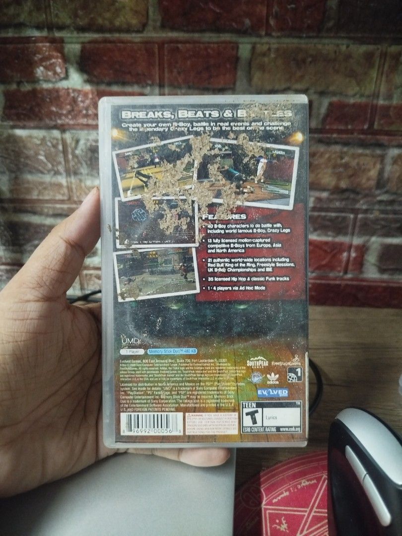 B-Boy PSP Game (Category: PlayStation) located in Binan City. Submitted by pumpkiiin02 (Listing ID 1467038079, Image 2). Description: - Game: B-Boy for Sony PlayStation Portable (PSP) - Publisher: SouthPeak Games - Includes: Original case, cover art insert, instruction manual, and UMD disc - Condition (Inside): UMD disc and manual are in decent shape and fully playable - Condition (Outside): Back cover has heavy sticker residue and paper damage.