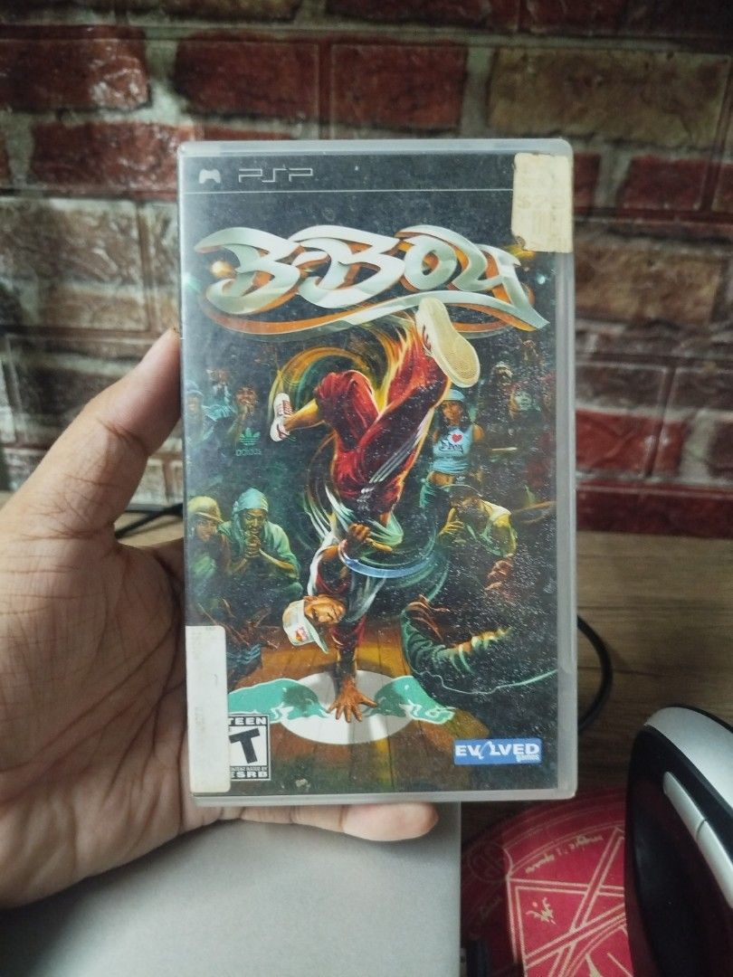 B-Boy PSP Game (Category: PlayStation) located in Binan City. Submitted by pumpkiiin02 (Listing ID 1467038079, Image 1). Description: - Game: B-Boy for Sony PlayStation Portable (PSP) - Publisher: SouthPeak Games - Includes: Original case, cover art insert, instruction manual, and UMD disc - Condition (Inside): UMD disc and manual are in decent shape and fully playable - Condition (Outside): Back cover has heavy sticker residue and paper damage.