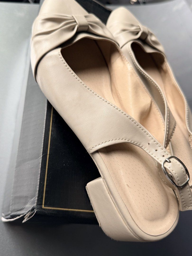 Beige Pointed-Toe Slingback Heels with Bow Detail (Category: Heels) located in Caloocan City. Submitted by ashpreloves (Listing ID 1467086095, Image 3). Description: - Style: Beige pointed-toe slingback heels with a sweet front bow - Heel: Comfortable low block heel for easy walking - Fit: Adjustable ankle strap with silver buckle - Material: Smooth faux leather with a cushioned inner sole - Condition: Clean overall, minimal signs of wear - Inclu