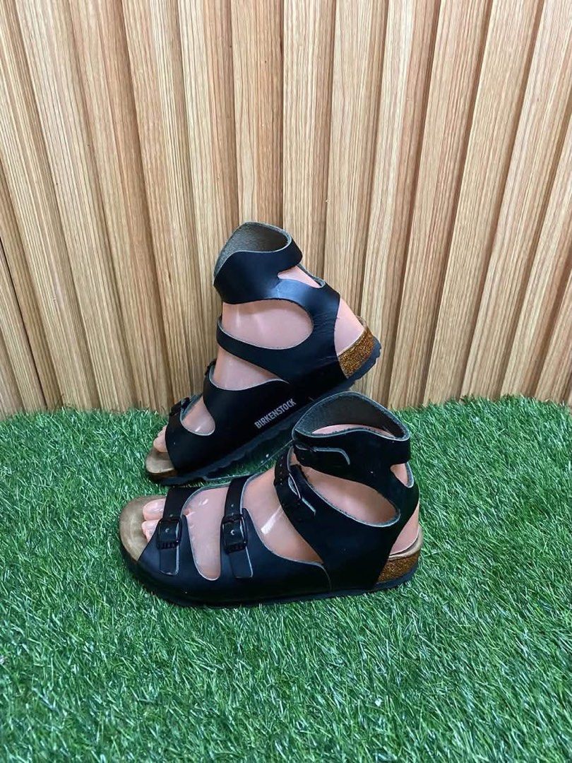Birkenstock Black Gladiator Sandals Size 36 (Category: Flats & Sandals) located in Butuan. Submitted by chang_14 (Listing ID 1467094777, Image 1). Description: - Brand: Birkenstock - Style: Black leather gladiator sandals with adjustable buckle straps - Size: 36 (Regular fit) - Origin: Made in Germany - Features: Signature comfortable cork footbed and treaded rubber sole - Condition: Clean footbeds, minimal wear on outsoles, ready to wear.