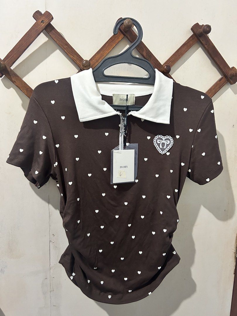 BKK Ivory Polo Top (Category: Blouses) located in Asingan. Submitted by prelovedbykimmy_ (Listing ID 1467001121, Image 1). Description: • brand new with tag • Ivory brand • chocolate brown color • stretchy.