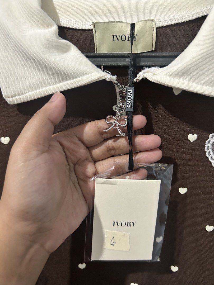 BKK Ivory Polo Top (Category: Blouses) located in Asingan. Submitted by prelovedbykimmy_ (Listing ID 1467001121, Image 3). Description: • brand new with tag • Ivory brand • chocolate brown color • stretchy.