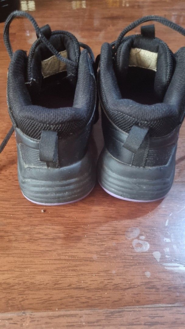 Black and Purple Athletic Sneakers (Category: Babies & Kids Fashion) located in Calamba. Submitted by kortking18 (Listing ID 1466977733, Image 1). Description: - Color: Black with vibrant purple accents on the outsoles and insoles - Design: Mid-top style with lace-up closure and convenient heel pull tabs - Performance: Textured midsoles for enhanced grip and stability - Authenticity: Inner tags with readable style codes included - Versatility: Id