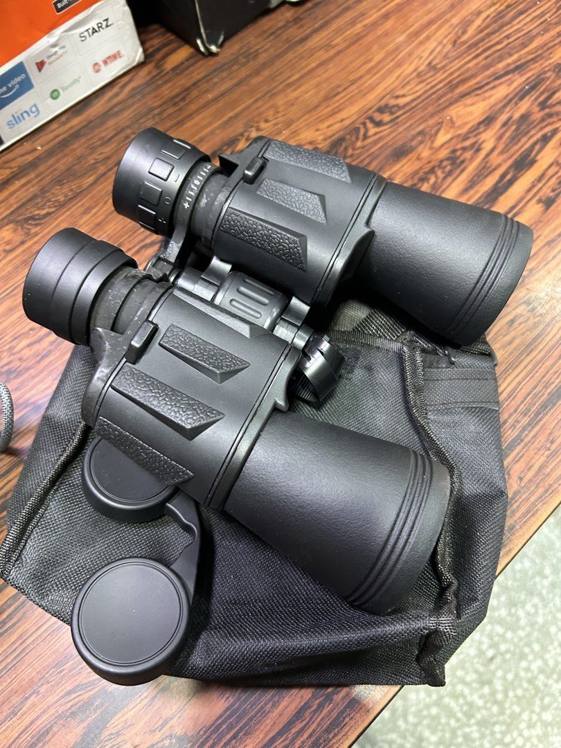 Black Binoculars with Case and Lens Caps (Category: Hiking & Camping) located in Manila. Submitted by starbalesukandjapansurplus (Listing ID 1466978086, Image 2). Description: -waterproof - Crystal clear glass lenses on both ends for sharp viewing - Smooth center focusing wheel and easily adjustable eyepieces - Includes a convenient soft black carrying case and multiple protective lens caps - Ideal for hiking, bird watching, camping, and other ou