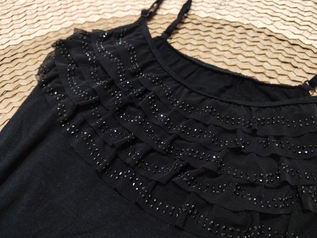 Black Cami Top Ruffled Front with Beading (Category: Sleeveless) located in San Juan City. Submitted by rhennx (Listing ID 1467156718, Image 2). Description: - Color: Black - Material: Soft fabric with mesh ruffles - Features: Adjustable spaghetti straps, chest ruffles with shiny beads - Fit: Fitted style - Condition: Excellent, clean with no loose threads or missing beads.