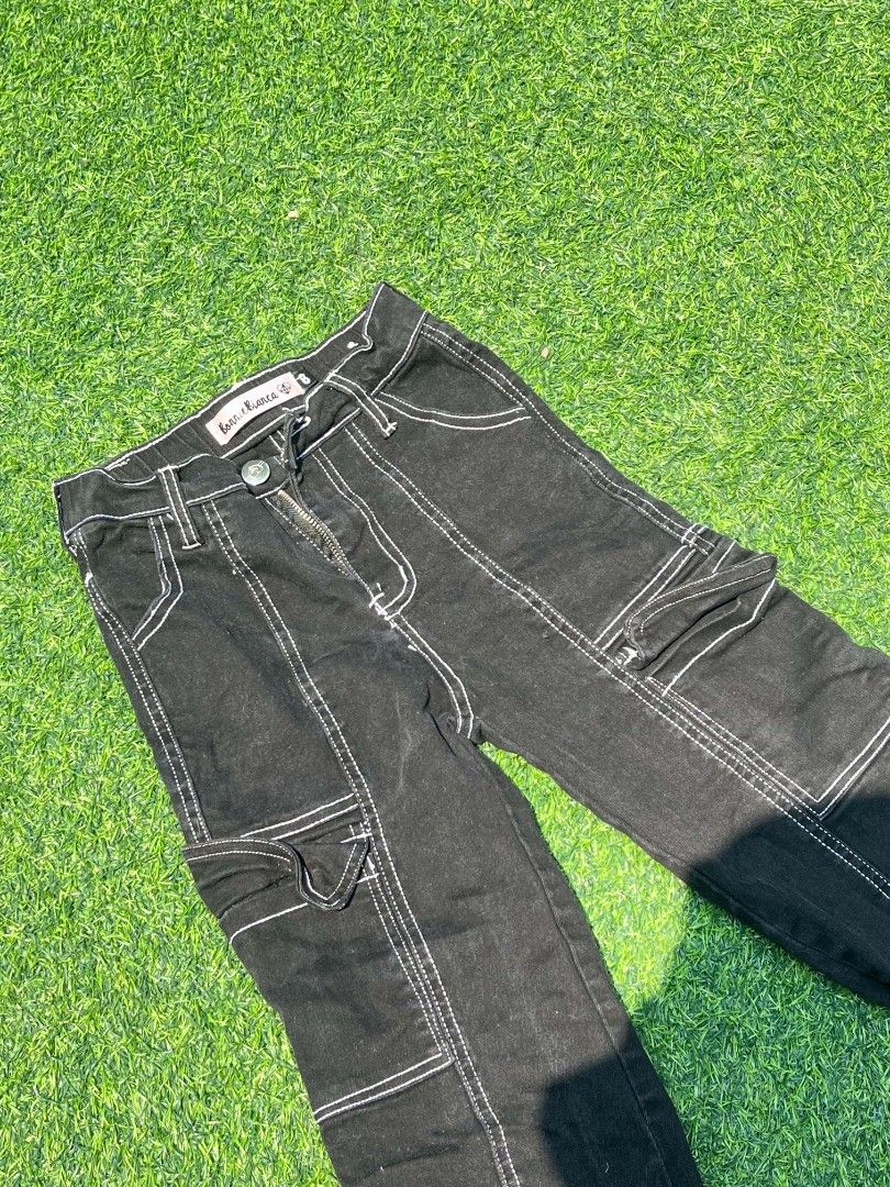 Black cargo pants with contrast white stitching size 8 (Category: Jeans) located in Imus. Submitted by warmgem.a59c42 (Listing ID 1467101822, Image 1). Description: Black cargo pants with contrast white stitching. Multiple pockets on the legs. Button closure with zip fly. Straight leg fit. Brand tag on the waistband reads bonne chance. Great everyday streetwear pants. Waist- 12inches Length - 33 inches Hips - 14inches.