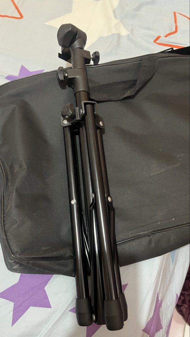 Black Folding Sheet Music Stand with Carrying Case (Category: Musical Instruments) located in Manila. Submitted by silentbird.811e41 (Listing ID 1467149084, Image 3). Description: - Color: Sleek black metal - Design: Ventilated desk panel for better airflow and lighter weight - Adjustability: Fully adjustable height and angle to suit your playing style - Portability: Sturdy tripod base folds down compactly - Inclusion: Comes with a free black zip