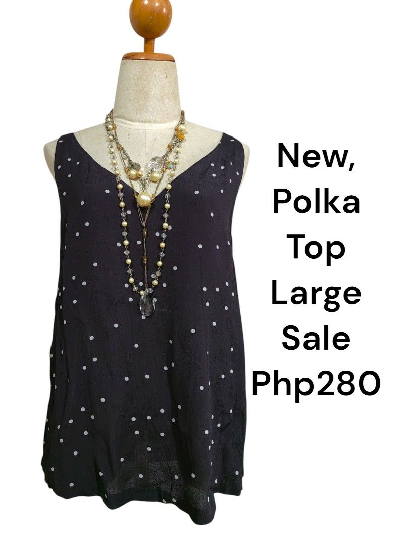 Black Polka Dot Sleeveless V-Neck Top Large (Category: Sleeveless) located in Davao. Submitted by gelleevanelli (Listing ID 1467085730, Image 1). Description: - Style: Sleeveless V-neck top with white polka dots - Fit: Relaxed and flowy - Size: Large Sale!!! firm on price - Material: Lightweight fabric, ideal for warm days - Bonus: Layered pearl necklace included - Price: Php 280 only.