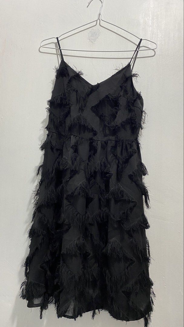 Black Spaghetti Strap Fringe Dress (Category: Dresses) located in Ozamiz City. Submitted by icadls (Listing ID 1467125624, Image 3). Description: Black slip dress with thin spaghetti straps and a v-neckline. Covered entirely in fringed trim texture. Lightweight fabric with a flared skirt shape. Great piece for parties, night outs, or events. Simple to style with heels and a handbag. Clean overall..