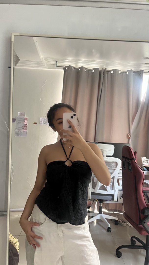 Black strapless halter tie top (Category: Sleeveless) located in Manila. Submitted by iayo.15 (Listing ID 1467060282, Image 2). Description: - Color: Black - Style: Strapless top with tie halter strap - Detail: Cute center ring accent - Texture: All-over crinkled fabric - Fit/Versatility: Easy to pair with high-waist jeans or skirts for any occasion.
