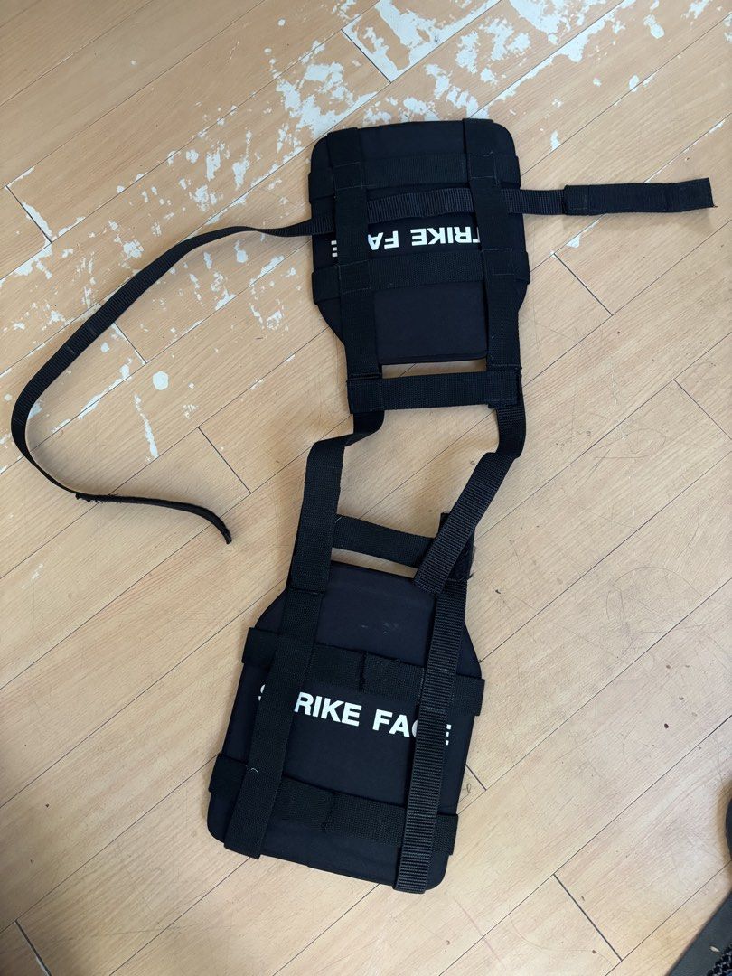 Black tactical vest with strike face text (Category: Vests) located in Manila. Submitted by fubu.fubu (Listing ID 1466985002, Image 1). Description: - Color: Black - Design: White "STRIKE FACE" text on front and back plates - Fit: Fully adjustable webbing straps with a simple mounting harness - Build: Solid and durable construction - Ideal for: Airsoft loadouts, tactical gear setups, and cosplay - Condition: Brand new / Ready to ship TWO PLATES N