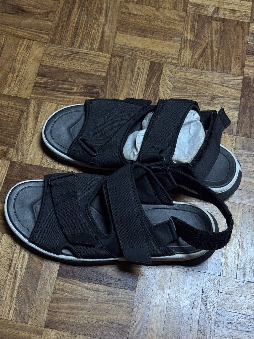 Black velcro strap comfort sandals (Category: Flats & Sandals) located in Manila. Submitted by seangoart (Listing ID 1467144400, Image 1). Description: - Color: Black - Style: Adjustable sandals with thick velcro straps - Comfort: Cushioned footbed for daily wear - Sole: Durable sole with a stylish white edge - Condition: Clean, well-maintained, stored with paper stuffing.