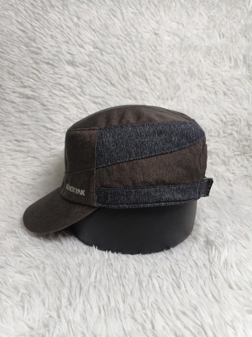 Black Yak Brown Mountain Cap Hat 58cm (Category: Hats & Beanies) located in Imus. Submitted by grindhouse.thriftshop (Listing ID 1467061719, Image 3). Description: - Brand: Black Yak - Style: Brown cadet hat with dark denim contrast panels - Size: 58cm - Details: Subtle side and back strap logo embroidery, printed branding on adjustable plastic buckle, and repeated logo text on interior sweatband - Condition: Clean inside and out.