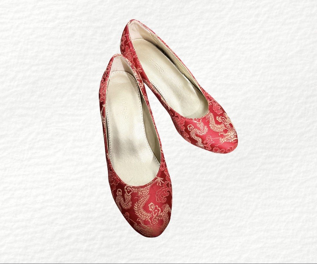 BLESS Red Dragon Brocade Low Heel Shoes (Category: Heels) located in Manila. Submitted by belles.clos3t (Listing ID 1467096393, Image 1). Description: - Stunning red satin heels with gold Chinese dragon and floral brocade pattern - Comfortable low block heel for easy, all-day walking - Elegant round toe, slip-on style with gold interior lining - Features the BLESS stamp on the insole - Ideal for Chinese New Year, weddings, and traditional celebra