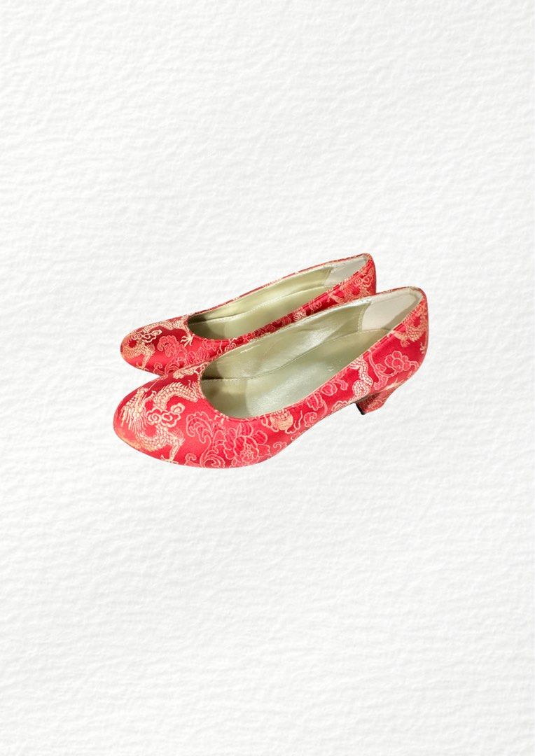 BLESS Red Dragon Brocade Low Heel Shoes (Category: Heels) located in Manila. Submitted by belles.clos3t (Listing ID 1467096393, Image 2). Description: - Stunning red satin heels with gold Chinese dragon and floral brocade pattern - Comfortable low block heel for easy, all-day walking - Elegant round toe, slip-on style with gold interior lining - Features the BLESS stamp on the insole - Ideal for Chinese New Year, weddings, and traditional celebra