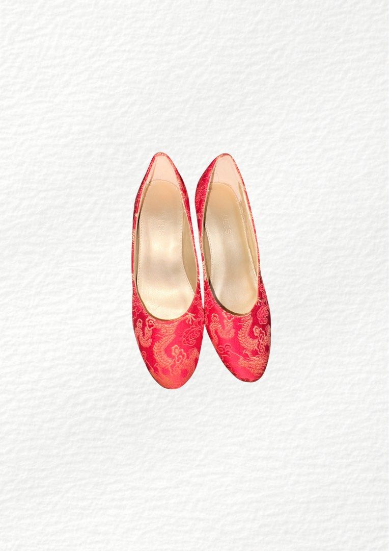 BLESS Red Dragon Brocade Low Heel Shoes (Category: Heels) located in Manila. Submitted by belles.clos3t (Listing ID 1467096393, Image 3). Description: - Stunning red satin heels with gold Chinese dragon and floral brocade pattern - Comfortable low block heel for easy, all-day walking - Elegant round toe, slip-on style with gold interior lining - Features the BLESS stamp on the insole - Ideal for Chinese New Year, weddings, and traditional celebra