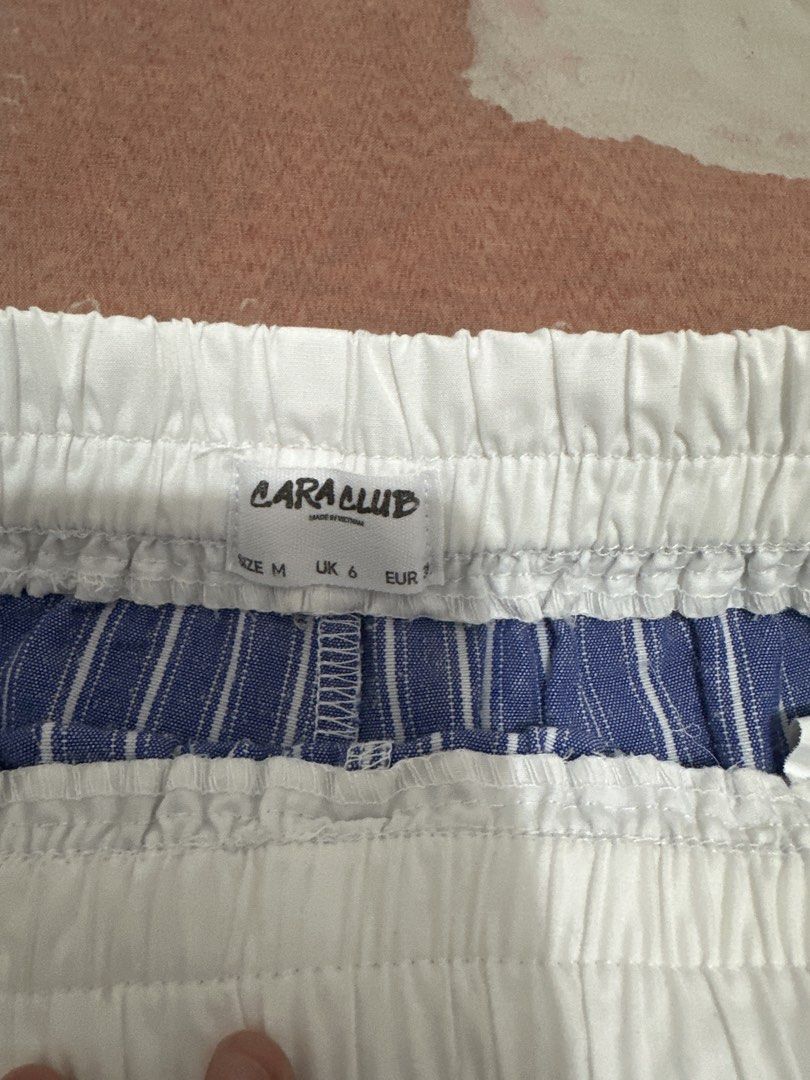 Blue and White Striped Lounge Shorts with Drawstring (Category: Shorts) located in Lipa City. Submitted by chiechums (Listing ID 1467054321, Image 3). Description: - Classic blue and white striped design - Comfortable elastic waistband with adjustable white drawstring - Lightweight, breathable fabric ideal for sleepwear or lounging - Relaxed fit through the legs for maximum comfort - Clean condition, freshly washed, and ready to wear.