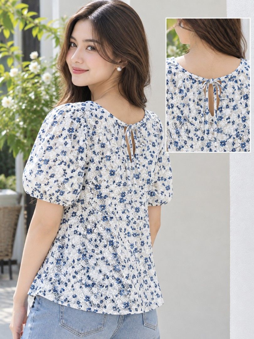 Blue Bloom Puff Sleeve Blouse (Category: Blouses) located in Mexico. Submitted by silverkatie429 (Listing ID 1467165092, Image 2). Description: A charming white blouse adorned with delicate blue floral prints, featuring puff sleeves and a round neckline with a dainty tie-back detail. Light and breezy, it pairs effortlessly with denim for a fresh, feminine look..