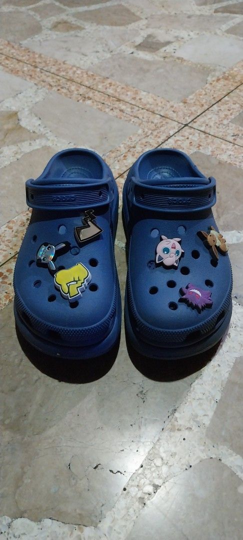 Blue Crocs Platform Clogs with Pokémon Jibbitz (Category: Sneakers & Footwear) located in Quezon City. Submitted by enryks.boxofstuff (Listing ID 1467068735, Image 1). Description: - Color: Navy blue - Style: Chunky platform clogs - Size: Men's US 8 / Women's US 10 - Includes authentic Pokémon Jibbitz charms: Pikachu, Eevee, Gengar, and Jigglypuff - Fun, playful, and trendy design - Shipping or meetups available across the Philippines.