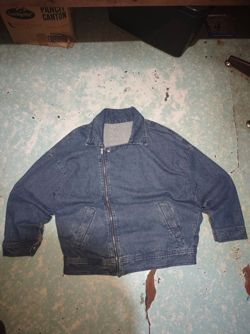 Blue Denim Harington Zip-Up Jacket (Category: Coats, Jackets and Outerwear) located in Calauag. Submitted by erv_1n (Listing ID 1461639002, Image 1). Description: - Classic blue denim jacket - Full zip-up front - Two chest pockets with button closures - Side pockets - Long sleeves with button cuffs - Collar neckline - Relaxed fit - Ideal for layering.