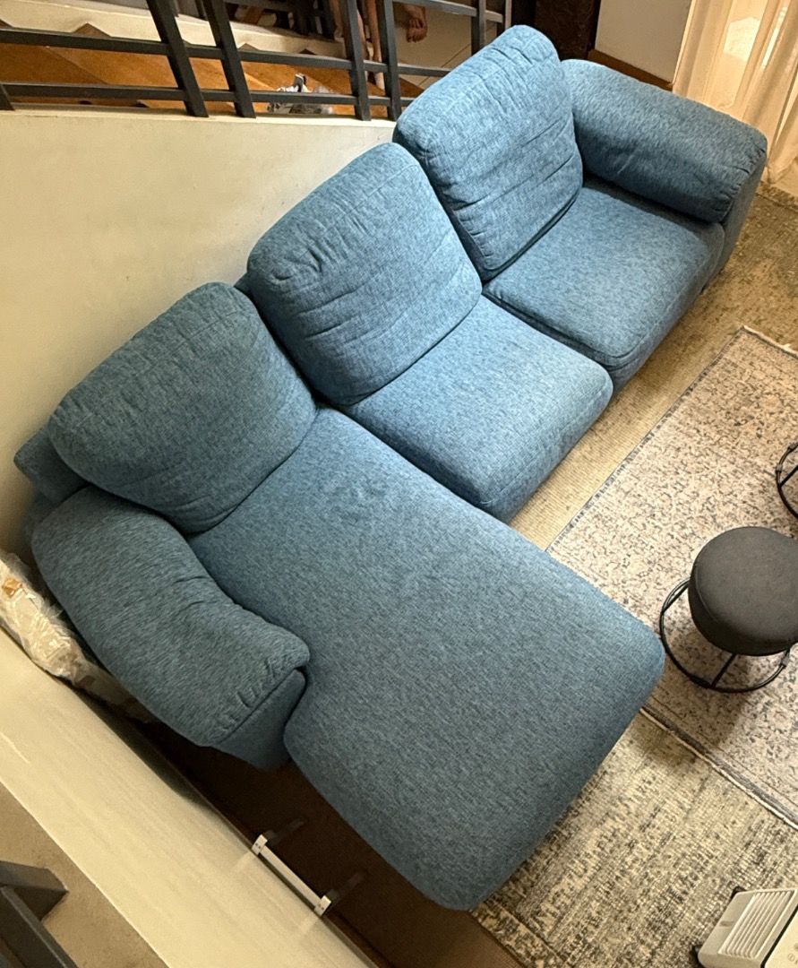 Blue Fabric L-Shaped Sectional Sofa with Chaise (Category: Sofas) located in Quezon City. Submitted by john33333 (Listing ID 1466995255, Image 1). Description: Italian 3-Seater Sofa with Chaise, Newly Upholstered A stylish Italian 3-seater sofa with a generous chaise, newly upholstered in a quality blue textured fabric. It has deep, comfortable cushions and a relaxed modern look, and it's in excellent condition. It's been kept protected under a f