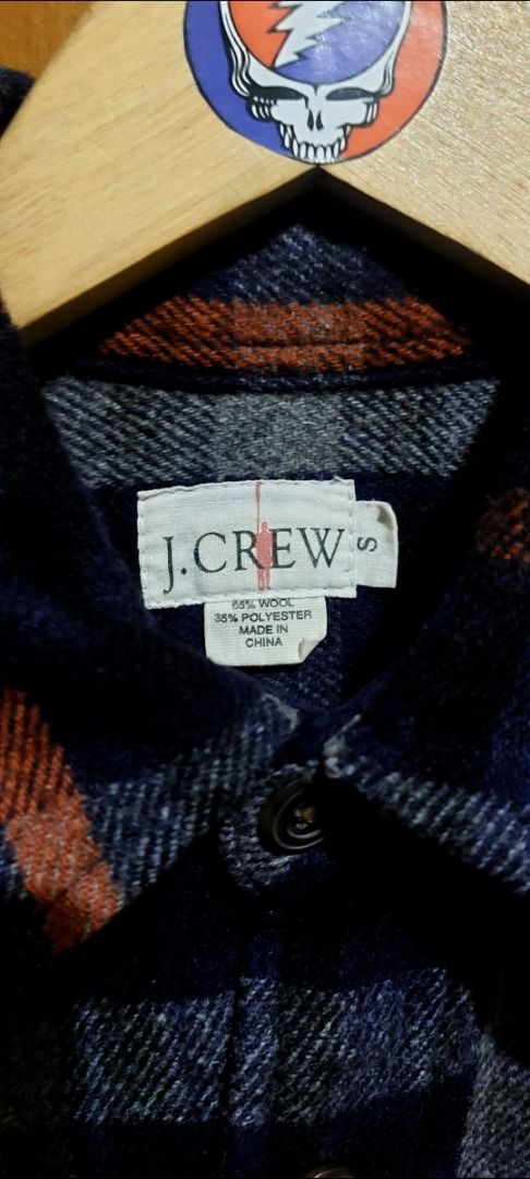 Blue Plaid Flannel Button-Down Shirt with Pockets (Category: Longsleeves) located in Legazpi City. Submitted by street_uniform (Listing ID 1467157840, Image 2). Description: - Dimes: W24 L29 - Color: Navy blue with grey and orange plaid pattern - Material: Soft, heavyweight flannel great for cold weather layering - Features: Two front chest pockets with button flaps - Closure & Cuffs: Button-down front and buttoned cuffs - Fit: Standard fit for e