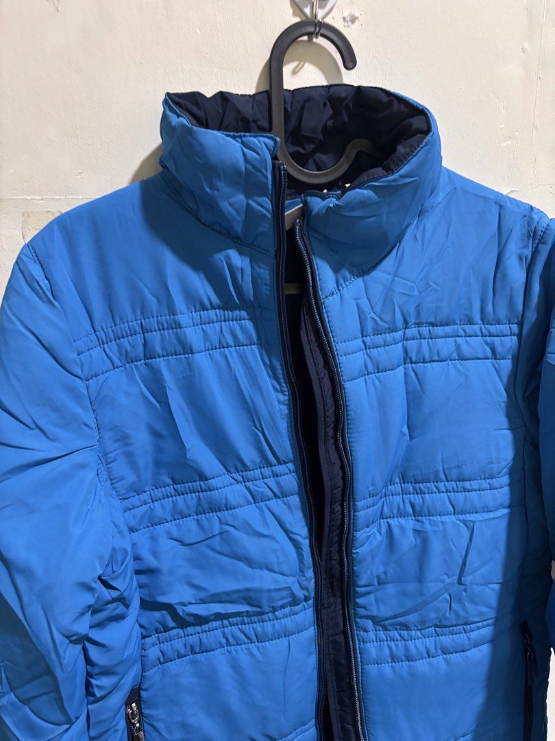 Blue Puffer Jacket - Women’s (Category: Coats, Jackets and Outerwear) located in Caloocan City. Submitted by ehannash (Listing ID 1466991157, Image 2). Description: - Brand/Model: Wind Sportswear Puffer Jacket - Color: Bright blue (great pop of color for winter) - Features: High collar neck, full zip front closure, and secure zipper pockets on both sides - Function: Keeps you warm and cozy during cold weather trips - Condition: Excellent, used on