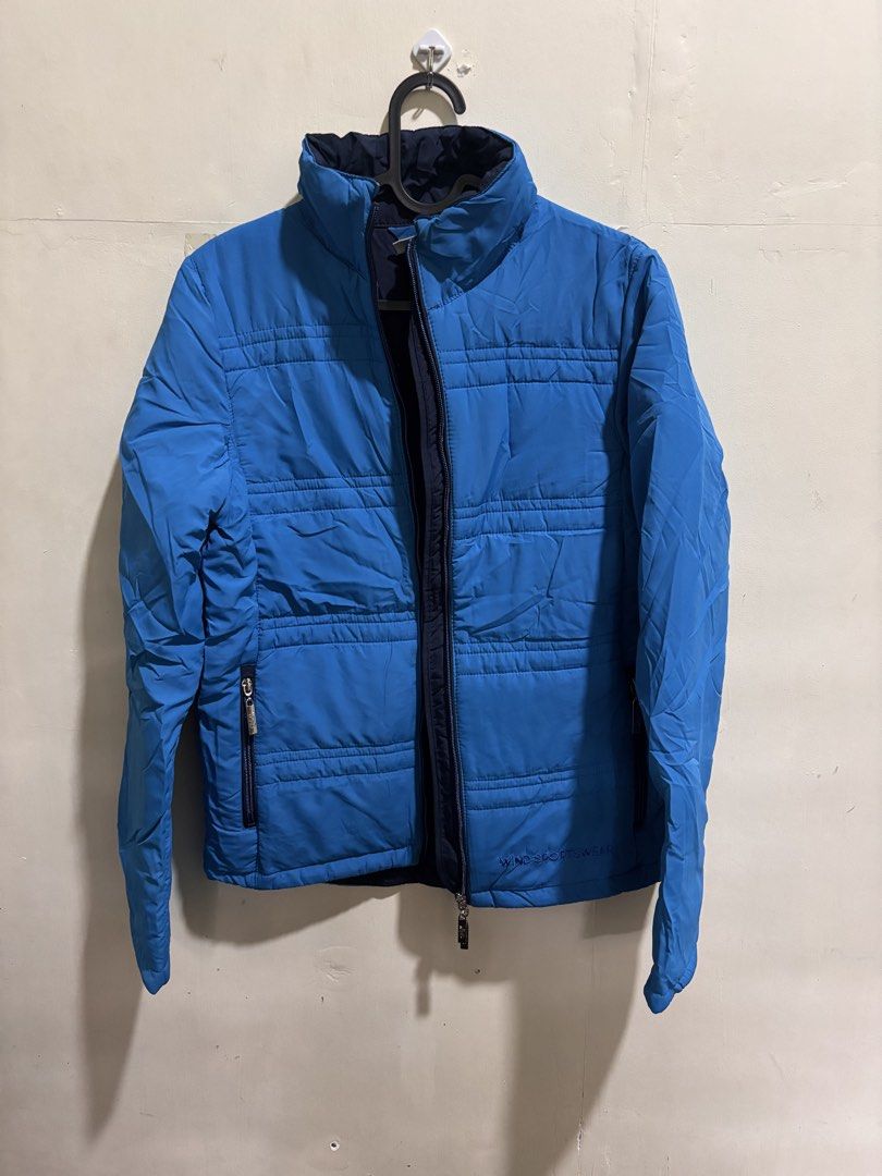 Blue Puffer Jacket - Women’s (Category: Coats, Jackets and Outerwear) located in Caloocan City. Submitted by ehannash (Listing ID 1466991157, Image 1). Description: - Brand/Model: Wind Sportswear Puffer Jacket - Color: Bright blue (great pop of color for winter) - Features: High collar neck, full zip front closure, and secure zipper pockets on both sides - Function: Keeps you warm and cozy during cold weather trips - Condition: Excellent, used on