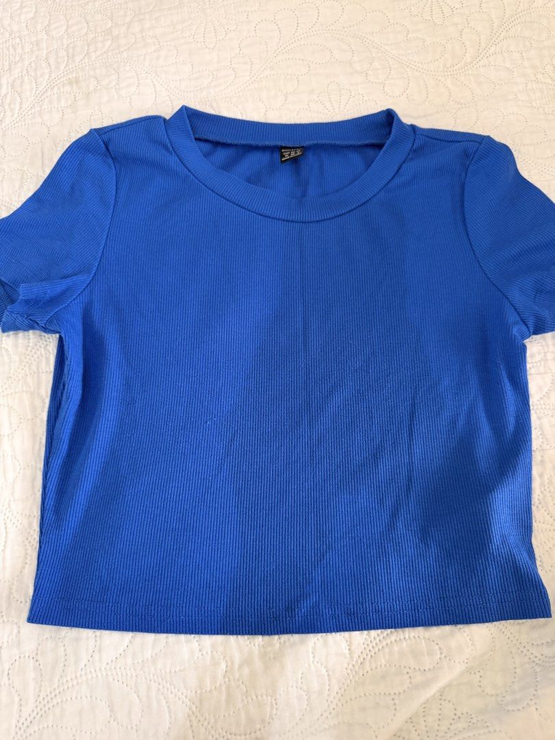 Blue Ribbed Crop Top Short Sleeve (Category: Shirts) located in Manila. Submitted by cassieuuu (Listing ID 1466993370, Image 1). Description: - Color: Bright blue - Style: Short-sleeve crop top with crew neckline - Fabric: Soft, stretchy ribbed material .